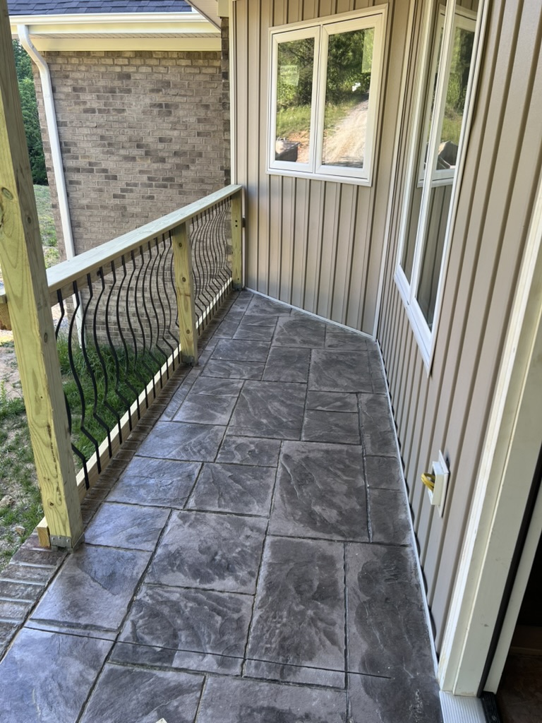 Stamped concrete porch with railing